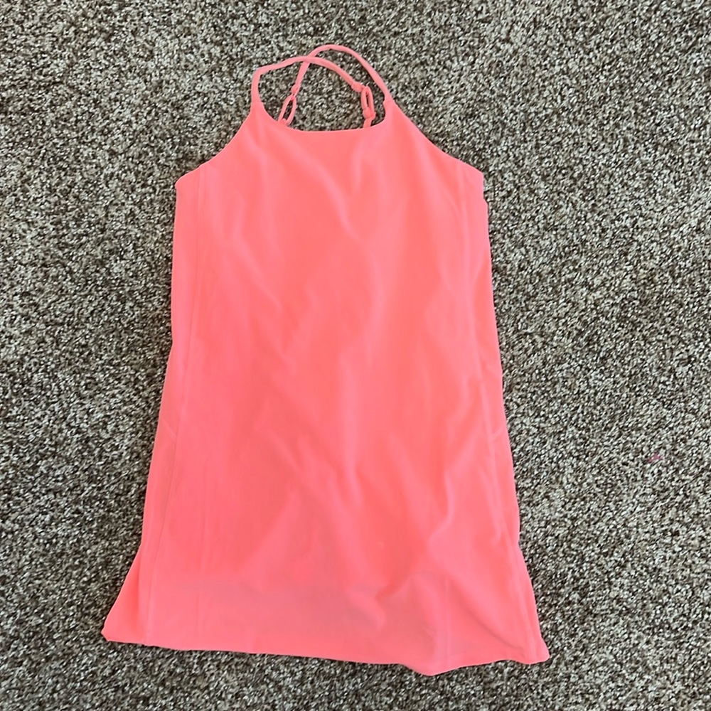 Athleta Girls size M bright orange active dress with built in bra and shorts.